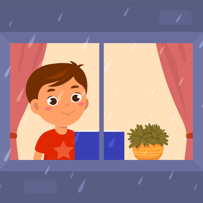 Child looking out a window on a rainy day