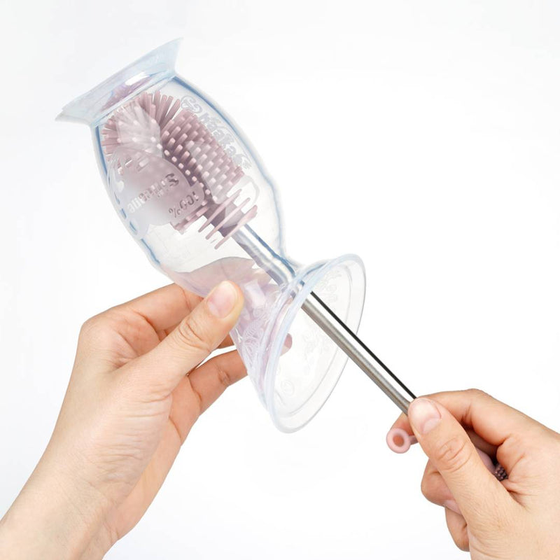 Haakaa Silicone Bottle Brush cleaning a Haakaa Gen 2 Breast Pump