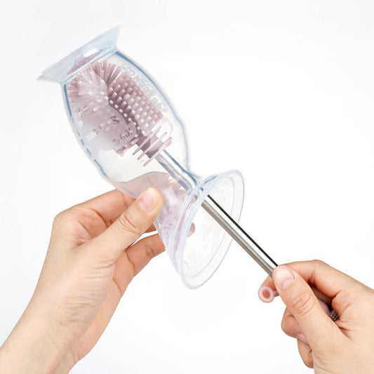 Haakaa Silicone Bottle Brush cleaning a Haakaa Gen 2 Breast Pump