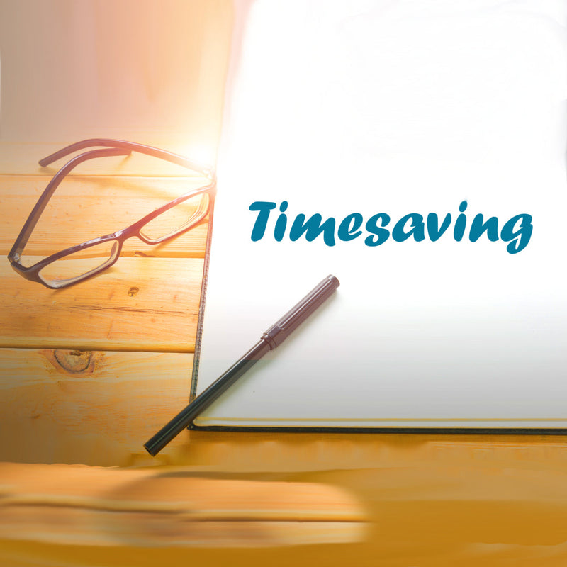 Image of a page on a wooden desk next to a pair of glasses and pen. The page says "Timesaving"