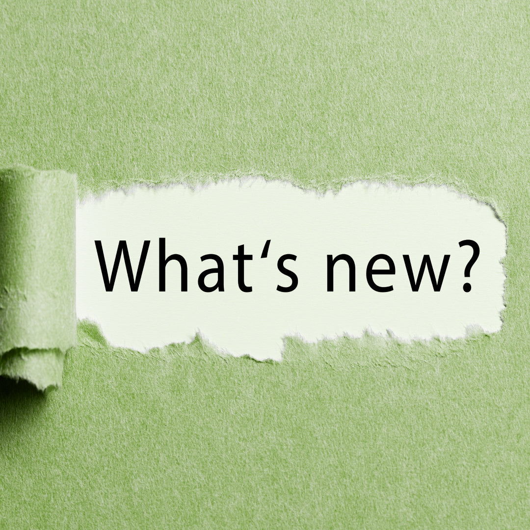 Green background with a torn paper effect, revealing the words 'What's New?'